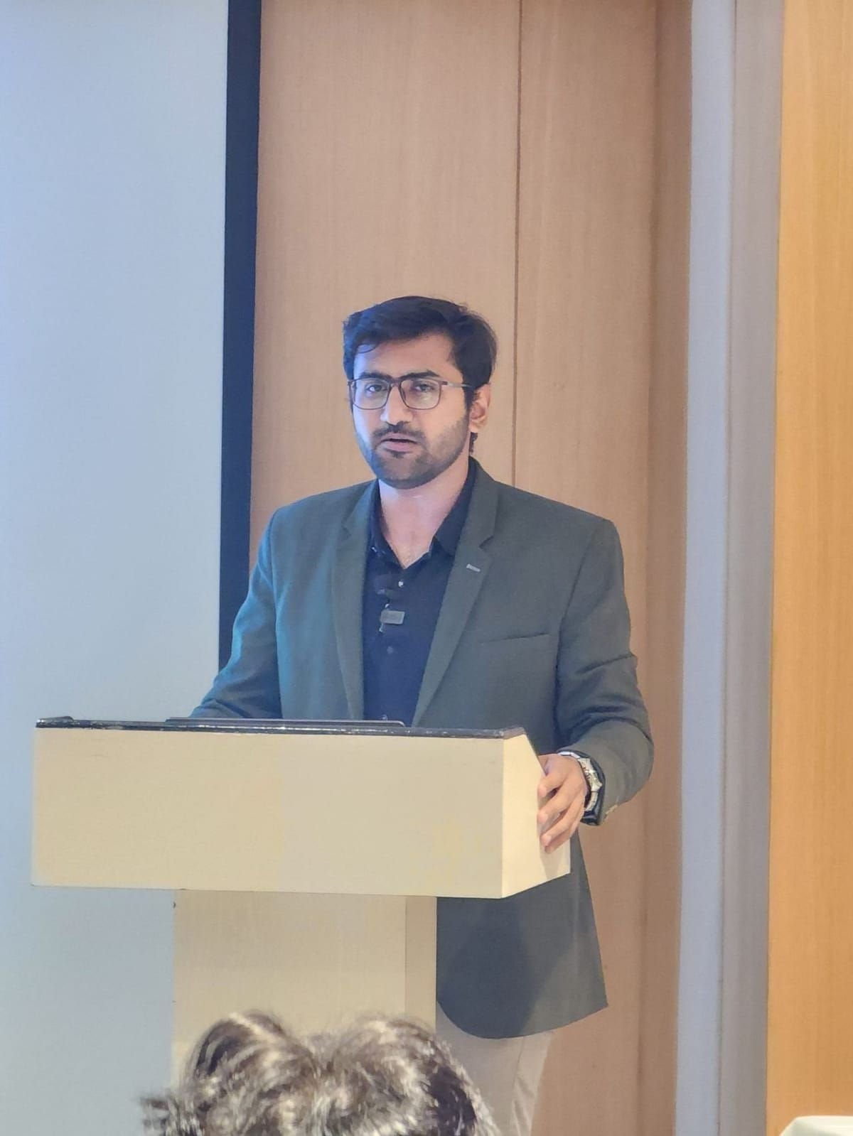 Viren Gajjar speaking at a corporate training session — Technical Lead in mobile app and AI development